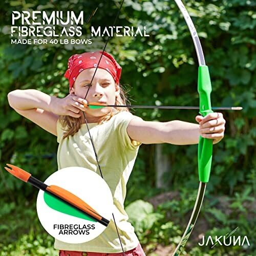 Child practicing archery with fibreglass bow and arrow.